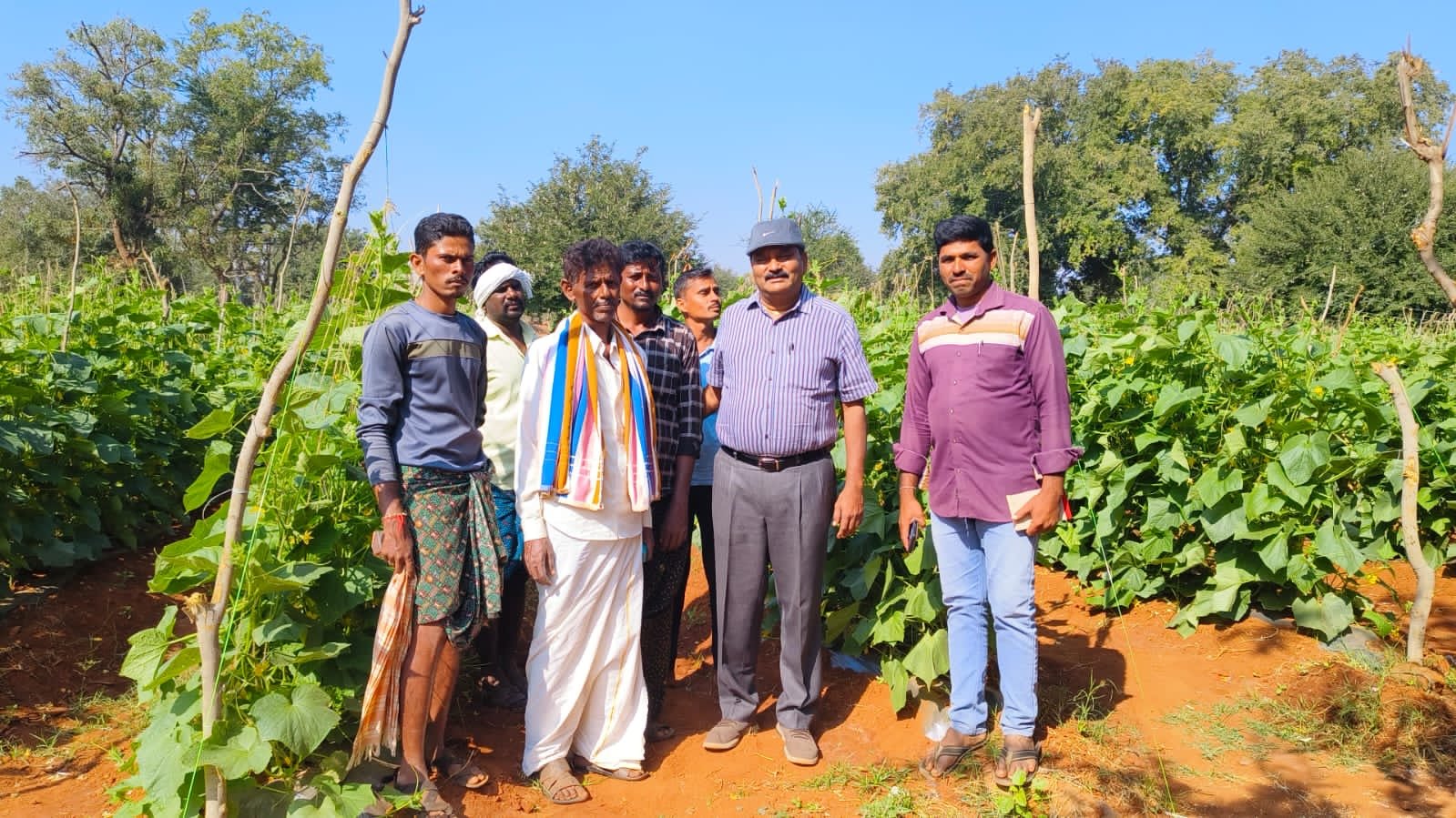 Cucu Agro team with farmers in a partner field